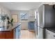 Modern kitchen features stainless steel appliances, granite countertops, and hardwood floors at 610 E Baseline Rd, Lafayette, CO 80026