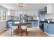 Spacious kitchen featuring stainless steel appliances, a granite countertop, and a breakfast bar at 610 E Baseline Rd, Lafayette, CO 80026