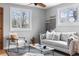 Inviting living room with ample natural light, neutral colors, and contemporary accents at 610 E Baseline Rd, Lafayette, CO 80026