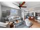 Open concept living room with modern furniture and a breakfast bar into the kitchen at 610 E Baseline Rd, Lafayette, CO 80026