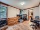 Bedroom with bunk beds, hardwood floors, a dresser, and desk with an adjacent bathroom at 19748 E Pinewood Dr, Aurora, CO 80016