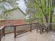 Back deck with a table and chairs features views of the yard and the house at 19748 E Pinewood Dr, Aurora, CO 80016