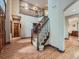 Grand foyer with hardwood floors, a staircase, and plenty of natural light at 19748 E Pinewood Dr, Aurora, CO 80016