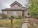 Charming brick home with a landscaped front yard and inviting entryway at 19748 E Pinewood Dr, Aurora, CO 80016