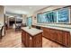 Bright kitchen featuring custom cabinets, stainless steel appliances and open access to dining area at 19748 E Pinewood Dr, Aurora, CO 80016