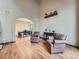 Bright living room with hardwood floors, two chairs, high ceilings and access to dining room at 19748 E Pinewood Dr, Aurora, CO 80016