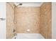 Close up on shower-bath combination that features a relaxing tile design at 17200 Waterhouse Cir # D, Parker, CO 80134