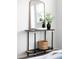 Console table with mirror and house plant provides cozy accent to bedroom at 17200 Waterhouse Cir # D, Parker, CO 80134