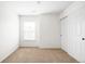 Bright bedroom featuring neutral carpet, a window with blinds, and a closet with sliding doors at 17200 Waterhouse Cir # D, Parker, CO 80134