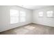 Bright bedroom with carpet, blinds, and large windows providing lots of natural light at 17200 Waterhouse Cir # D, Parker, CO 80134