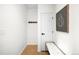 Bright entryway with bench seating, coat hooks, and artwork on the wall at 17200 Waterhouse Cir # D, Parker, CO 80134