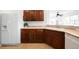 Bright kitchen features wooden cabinetry, stainless steel appliances, and tile flooring at 17200 Waterhouse Cir # D, Parker, CO 80134