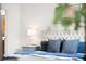 Close up on the bed in the main bedroom with a stylish side table and lamp at 17200 Waterhouse Cir # D, Parker, CO 80134