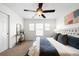 Relaxing bedroom features neutral walls, ceiling fan, natural light and ensuite bath at 17200 Waterhouse Cir # D, Parker, CO 80134