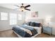Relaxing bedroom features neutral walls, ceiling fan, natural light and ensuite bath at 17200 Waterhouse Cir # D, Parker, CO 80134