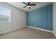 Neat bedroom design with carpet flooring, minimalist decor, and natural light from the window at 6805 Canosa St, Denver, CO 80221