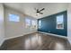 Bright main bedroom with hardwood floors, contemporary design, and plentiful natural light at 6805 Canosa St, Denver, CO 80221