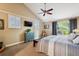 Cozy bedroom with vaulted ceilings, dual windows and decorative ceiling fan at 2356 Hiwan Dr # 40, Evergreen, CO 80439