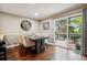 Cozy dining room with a modern table and chairs, and sliding glass doors to the deck at 2356 Hiwan Dr # 40, Evergreen, CO 80439