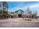 Attractive exterior of the community center with glass facade, stone accents and ample parking at 2356 Hiwan Dr # 40, Evergreen, CO 80439