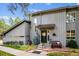 Charming gray two-story home with landscaped yard and welcoming entrance at 2356 Hiwan Dr # 40, Evergreen, CO 80439