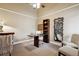 Home office with high ceiling, functional desk, bookshelf and tree art makes working remotely enjoyable at 2356 Hiwan Dr # 40, Evergreen, CO 80439