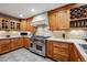 Well-equipped kitchen with custom wood cabinets, countertops, and stainless steel appliances at 2356 Hiwan Dr # 40, Evergreen, CO 80439