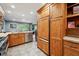 Well-lit kitchen with stainless steel appliances and light-colored countertops and views to the backyard at 2356 Hiwan Dr # 40, Evergreen, CO 80439