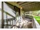 Secluded patio featuring a shaded seating area and views of the surrounding trees and greenery at 2356 Hiwan Dr # 40, Evergreen, CO 80439