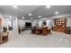 Expansive basement featuring an entertainment area, dining space, and neutral carpeting throughout for a modern living experience at 2020 Sagerock Dr, Castle Pines, CO 80108