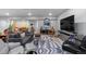 Finished basement featuring a seating area with stylish decor, providing a comfortable and versatile living space at 2020 Sagerock Dr, Castle Pines, CO 80108