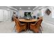 Finished basement with a dining table, seating area, and entertainment setup, offering a versatile living experience at 2020 Sagerock Dr, Castle Pines, CO 80108