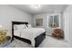 Cozy bedroom featuring a plush bed, large window, and stylish accents that create a relaxing atmosphere at 2020 Sagerock Dr, Castle Pines, CO 80108