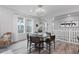 Dining area with a round table, four chairs, and natural light from the window at 2020 Sagerock Dr, Castle Pines, CO 80108