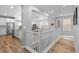 Inviting foyer showcasing a wood floor and a glimpse of the open concept living space at 2020 Sagerock Dr, Castle Pines, CO 80108