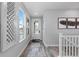 Bright foyer with wood floors, stylish décor, and a staircase leading to the upper level at 2020 Sagerock Dr, Castle Pines, CO 80108