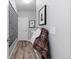 Well-organized hallway with coat storage, a decorated wall, and durable floors at 2020 Sagerock Dr, Castle Pines, CO 80108