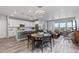 Spacious living area with an open layout, featuring a modern kitchen and dining space at 2020 Sagerock Dr, Castle Pines, CO 80108