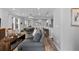 Open-concept living area with a kitchen, dining room, and comfortable seating at 2020 Sagerock Dr, Castle Pines, CO 80108