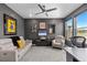 Modern office featuring a comfortable couch, artwork, and a bright window at 2020 Sagerock Dr, Castle Pines, CO 80108