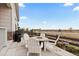Charming patio with Adirondack chairs arranged around a fire pit, perfect for outdoor entertaining at 2020 Sagerock Dr, Castle Pines, CO 80108