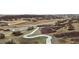 Aerial view of a winding concrete walking path through a natural landscape at 2020 Sagerock Dr, Castle Pines, CO 80108
