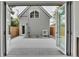 View of the backyard patio showcasing a detached garage with modern design elements at 671 Elati St, Denver, CO 80204