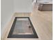 Unique basement entrance featuring a glass door and ample natural light at 671 Elati St, Denver, CO 80204