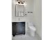 Stylish bathroom featuring sleek black vanity with gold accents and modern fixtures at 671 Elati St, Denver, CO 80204