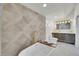 Modern bathroom with standalone tub, shower, and beautifully designed vanity area at 671 Elati St, Denver, CO 80204