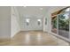 Bright, airy bedroom with large windows opening to a wood deck and natural light at 671 Elati St, Denver, CO 80204