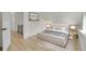 Comfortable bedroom features a calming color palette, soft rug, and easy access to the hallway at 671 Elati St, Denver, CO 80204