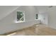 Bright bedroom featuring hardwood floors, two windows and a large built-in wardrobe at 671 Elati St, Denver, CO 80204