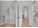 Walk-in closet with built-in storage and easy access to bedroom and bathroom at 671 Elati St, Denver, CO 80204